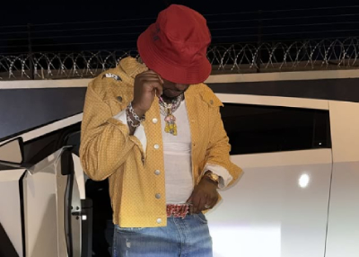 Davido with car and jewelry